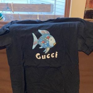 Mega yacht Gucci rainbow fish shirt